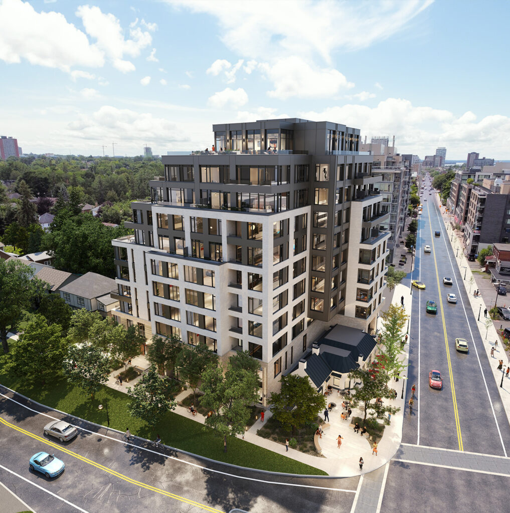 Aerial view of a neutral-coloured apartment building with trees in front and streets on both sides.
