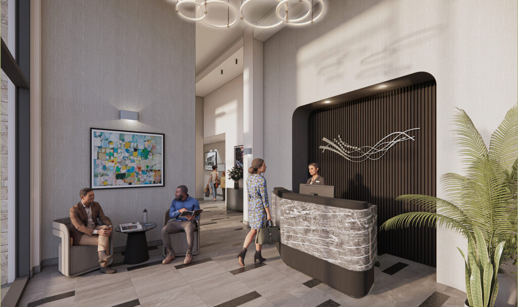 Woman talking to a receptionist in an apartment lobby with people sitting nearby.